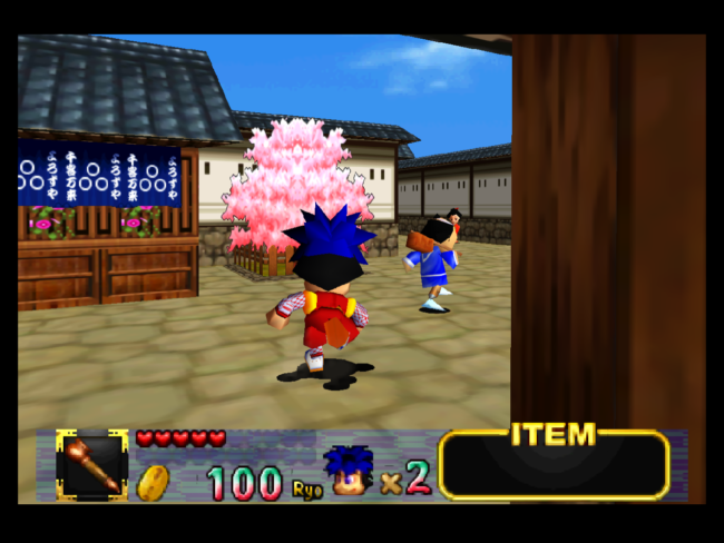 Goemon approaches a cherry blossom tree in one of the town zones.