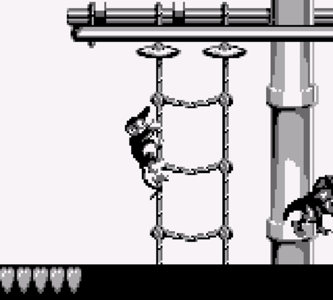 The main character climbs ropes in a pirate ship level.