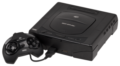 The Sega Saturn console with one controller attached.