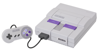 The Super Nintendo home console with one controller attached.