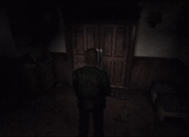 James checks out a door in a dimly lit hallway using his flashlight.