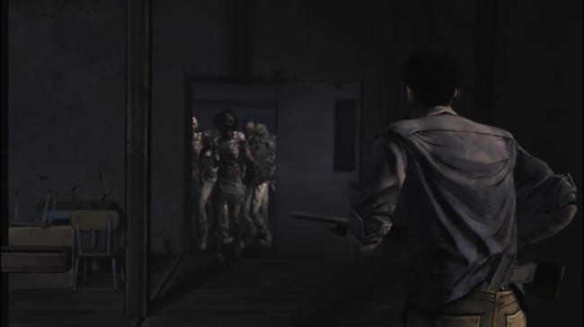 Lee approaches a doorway of zombies while armed with a shotgun.