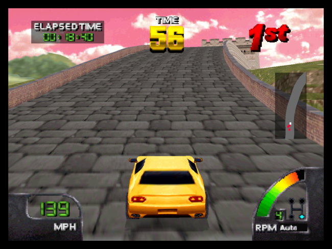 A yellow car races across the top of the Great Wall of China.