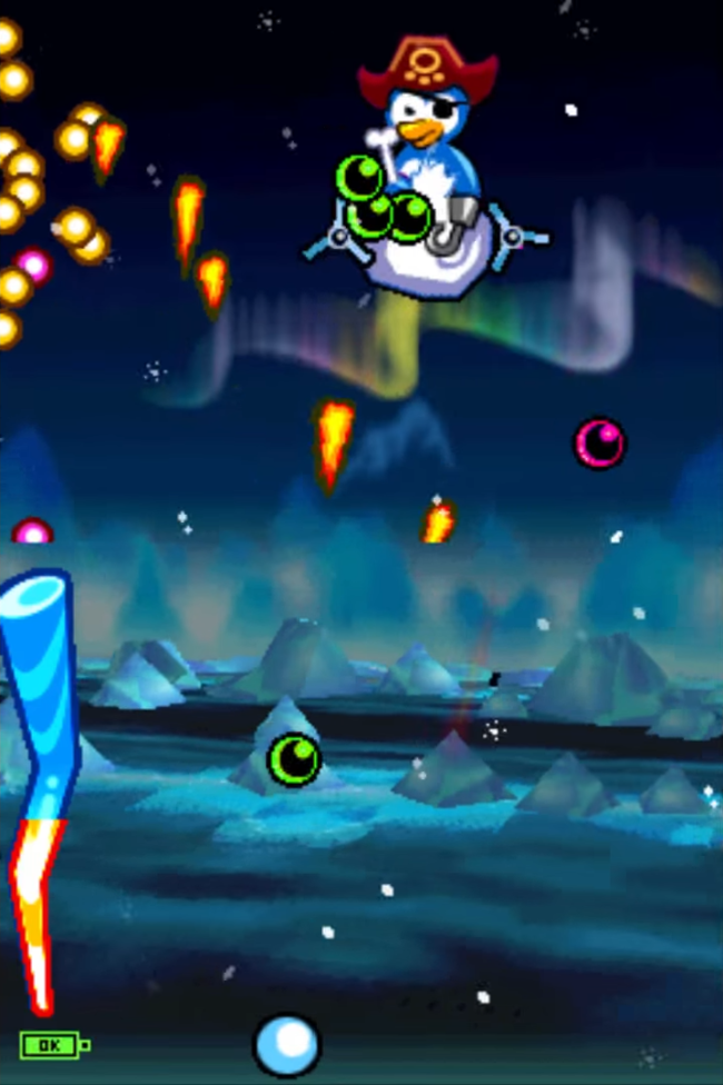 A pirate penguin drops green balls from the top screen over a snow covered background.