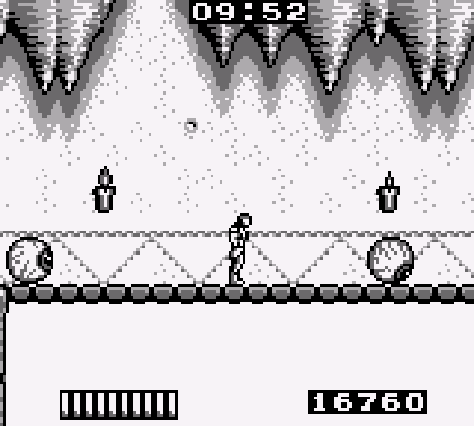 The player walks to the right with giant eyeballs rolling both in front and behind him.