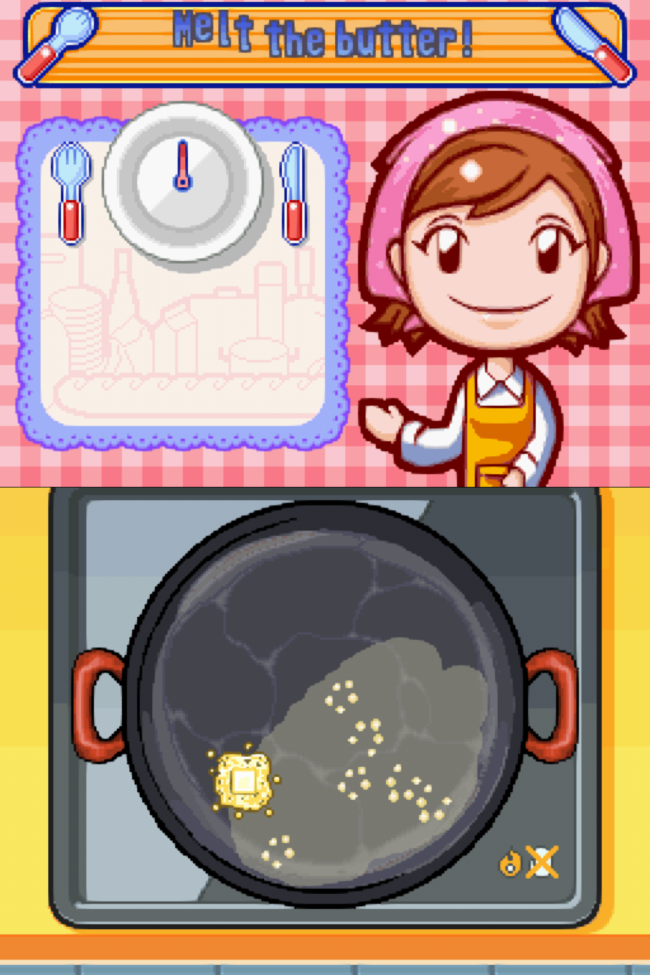 An overhead view of butter melting in a skillet.