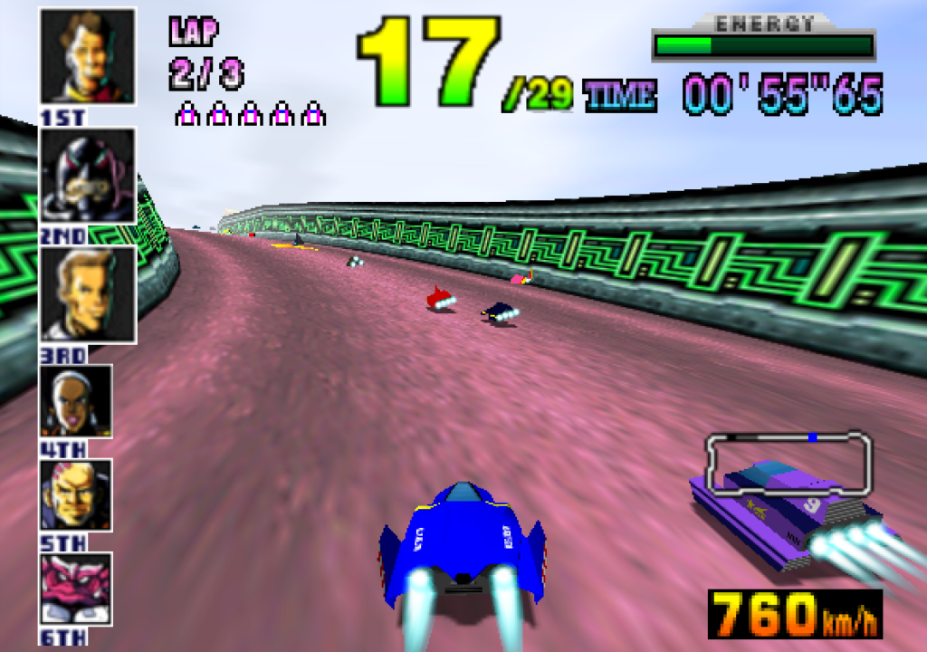 Futuristic hovercars race on a pink track with green barriers.