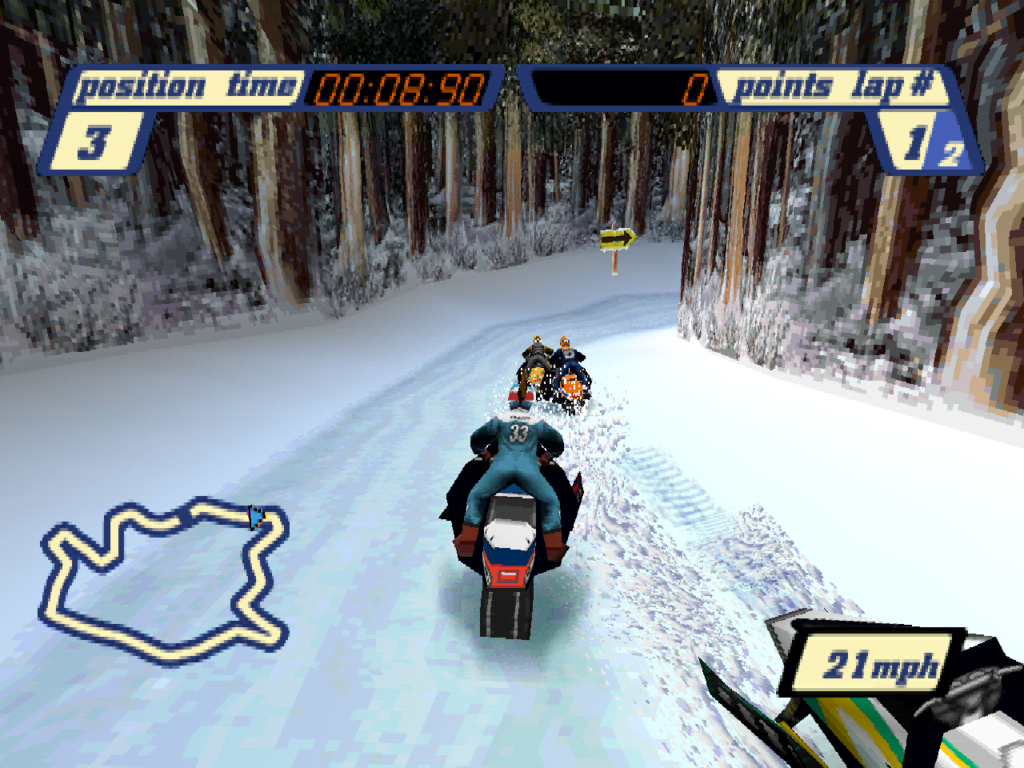 Racers compete on a downhill track through a forest.
