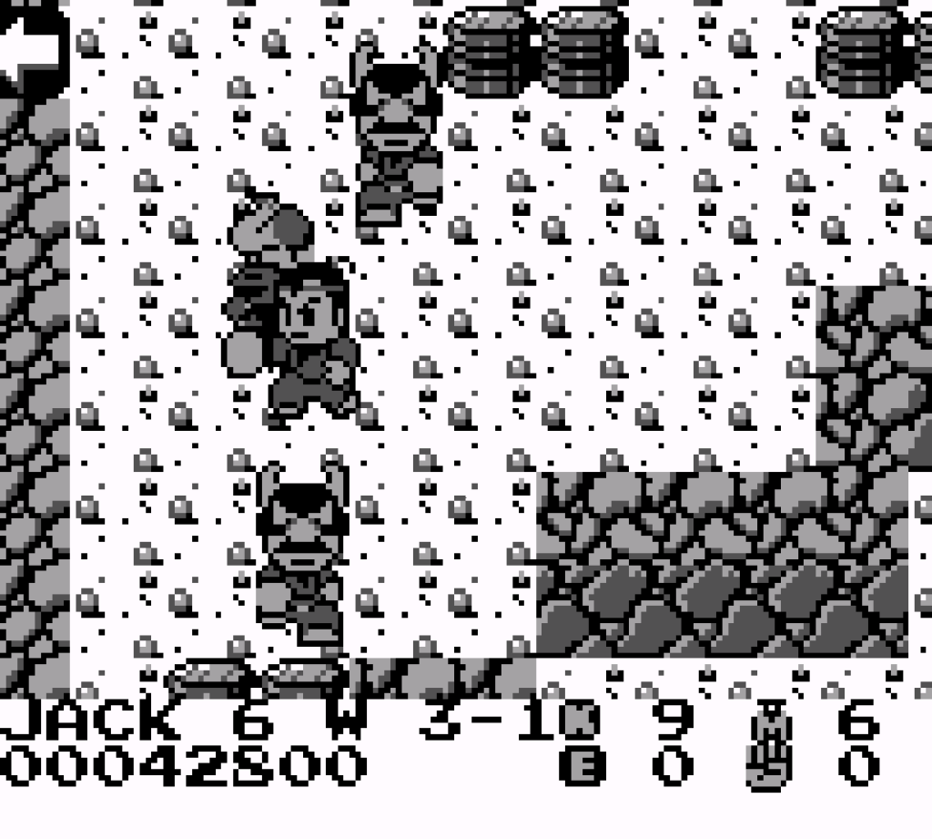 The main character punches enemies in a mountain based level.